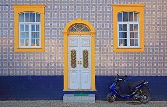 House facade with traditional azulejo tiles in Ferragudo