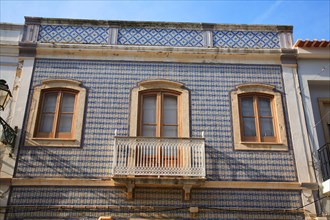 House with facade with tiles