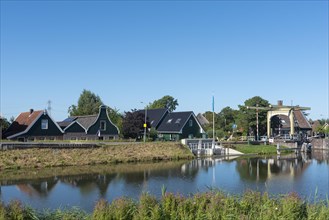 Village scene with canal bridge at the Drechterlandsdijk