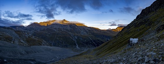 Tschierva hut above Val Rosegg and Engadine mountains at blue hour