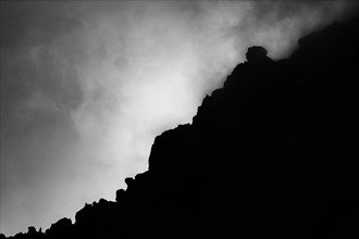 Rock ridge in Bernina group with dramatic clouds
