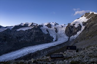 Morteratsch glacier with Boval hut in Bernina group at sunrise