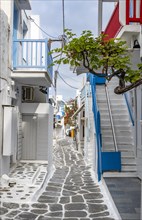White Cycladic houses with colourful railings