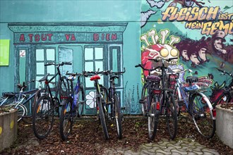 Bicycles in front of mural in the former Olympic Village