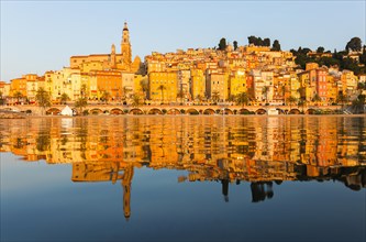 Reflection in the sea of the town of Menton