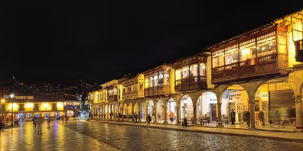 Spanish colonial buildings with balconies at night