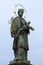 Statue of St John Nepomuk or John of Pomuk on Charles Bridge