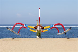 Brightly painted fishing outriggers on the beach at Sanur