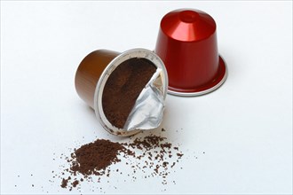 Opened coffee capsule and coffee powder