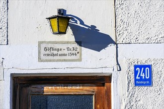 Facade of a farm with lantern and info -mentioned anno 1394- at Mariaberg