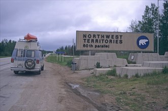 Motorhome at the notice to enter the Northwest Territory at the sixtieth parallel