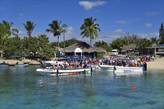 Tourists are taken in boats to Isla Saona