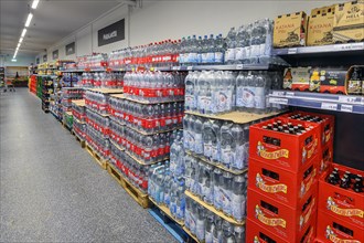 Shelves with mineral water and beverages in the wholesale market