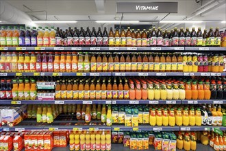 Shelves with fruit juices and drinks in the wholesale market