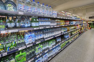 Shelves with mineral water and beverages in the wholesale market