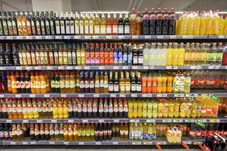Shelves with fruit juices and drinks in the wholesale market