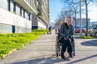 A disabled person having fun walking on the street in a wheelchair