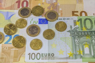 Euro coins on top of Euro bank notes