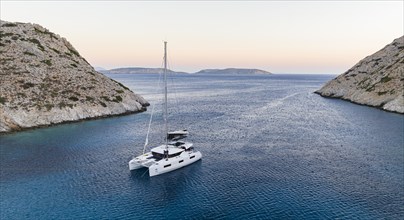 Sailing catamaran in a bay of Levitha Island