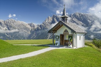 Chapel in front of mountain scenery