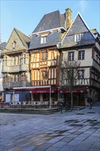 Half-timbered houses clad in slate on the Place du General Leclerc