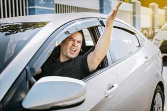 Driver man yelling at driver while driving