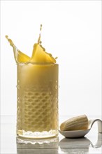 Banana smoothie with fresh fruit and cookie splash effect
