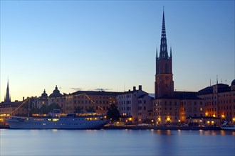 Illuminated houses and ship in Gamla Stan
