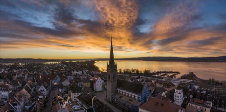 Aerial view of the town of Radolfzell on Lake Constance with the Radolfzell Minster in front of sunrise