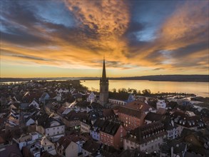 Aerial view of the town of Radolfzell on Lake Constance with the Radolfzell Minster in front of sunrise