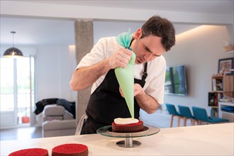 A challenger man bakes a red velvet cake at home
