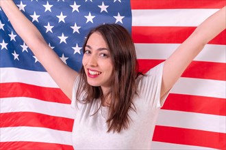 Caucasian woman smiling with usa flag isolated on a white background
