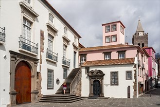 Small square in the old town with colourful houses and chapel Capela de Santo Antonio de Mouraria