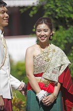 A couple in traditional wedding dress
