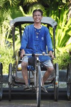 Laughing cycle rickshaw driver