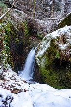 Waterfall with snow in winter