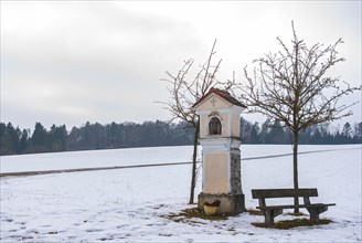 Catholic wayside shrine on the Swabian Alb in winter