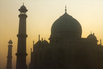 Taj Mahal with its minarets at sunrise