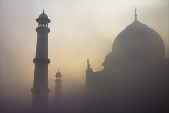 Taj Mahal at sunrise on a misty
