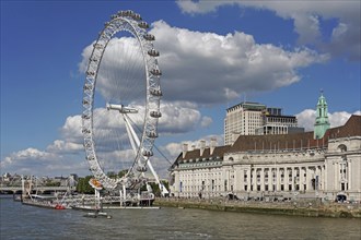 The London Eye Ferris Wheel and County Hall on the banks of the Thames