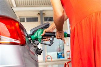 Refueling gasoline or diesel at the gas station in the fuel crisis with the high prices