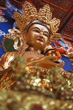 Golden Buddha statue at Tseway Monastery