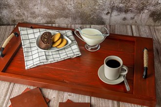 Wooden breakfast tray with coffee
