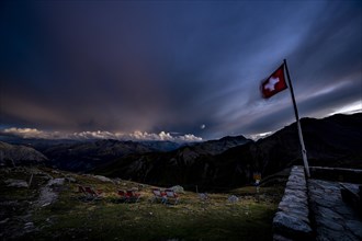 Engadine mountains with cloudy sky at blue hour