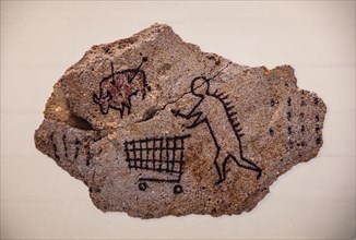 Banksys version of a primitive cave painting on the prowl with a shopping trolley