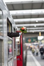 Reception with a bouquet of flowers at the station
