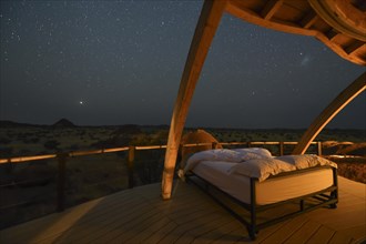 Bed under the stars in a chalet at Onduli Ridge Lodge