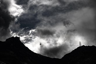 Cable car to Piz Murtel with dramatic clouds