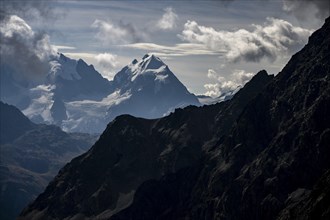 Bernina Group with Engadine Mountains with Cloudy Sky