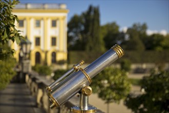 Old telescope at the orangery with baroque park Karlsaue